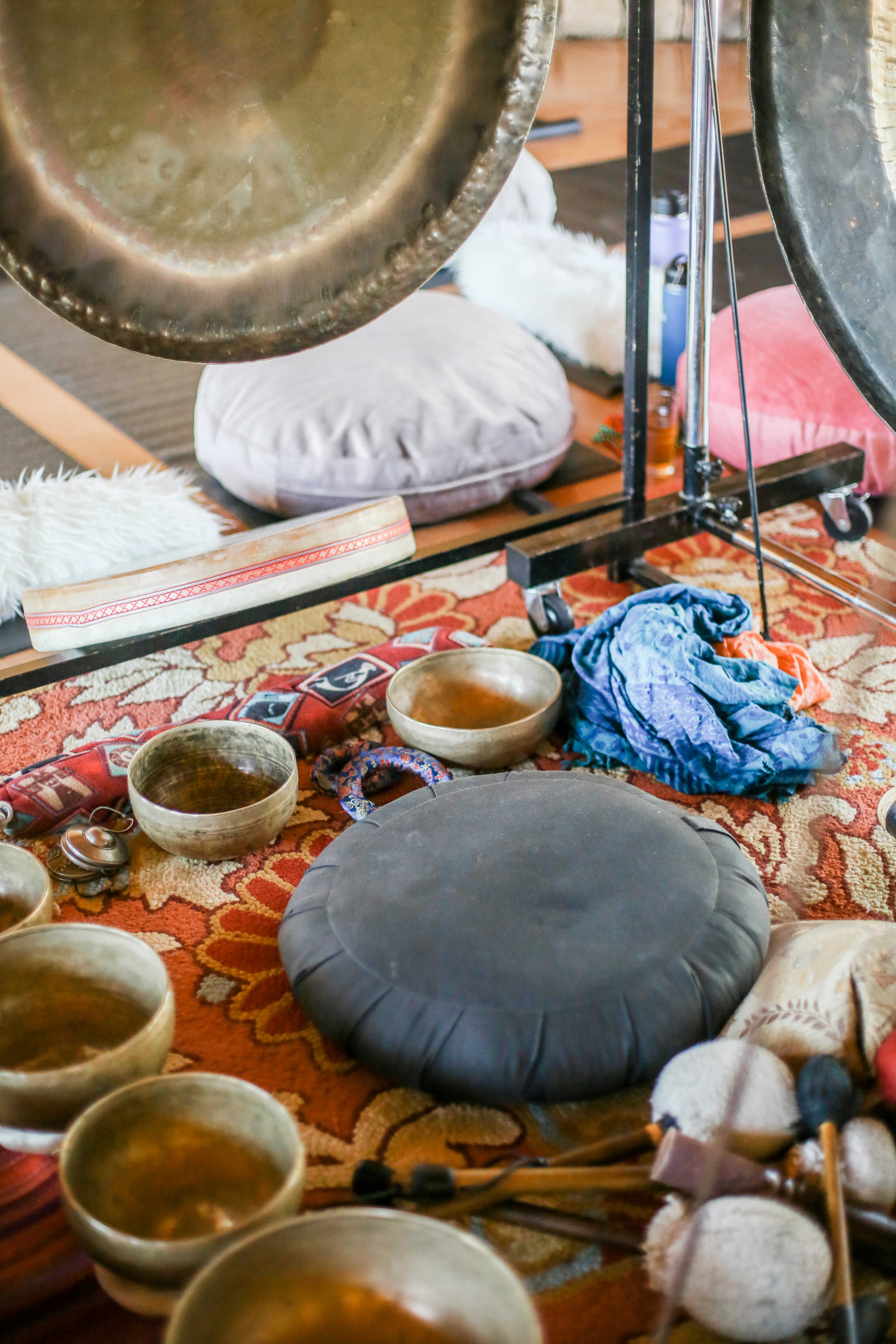 Various sound healing bowls and gongs used in sound healing